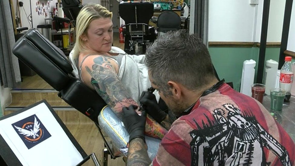 Bronwen Matthews receives another tattoo from artist Lee Clements