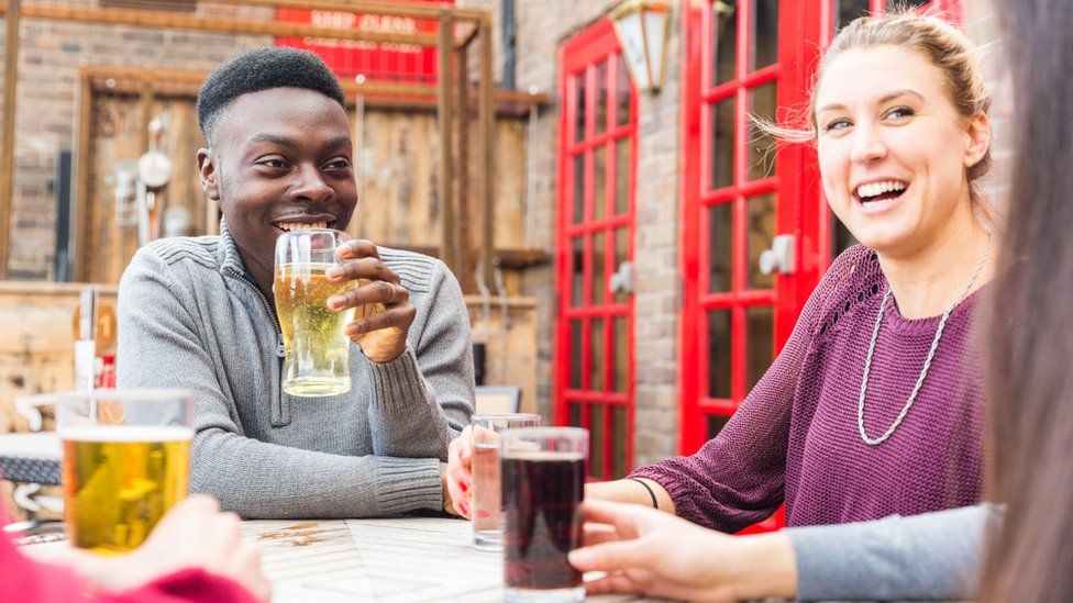 A man and a woman in a beer garden