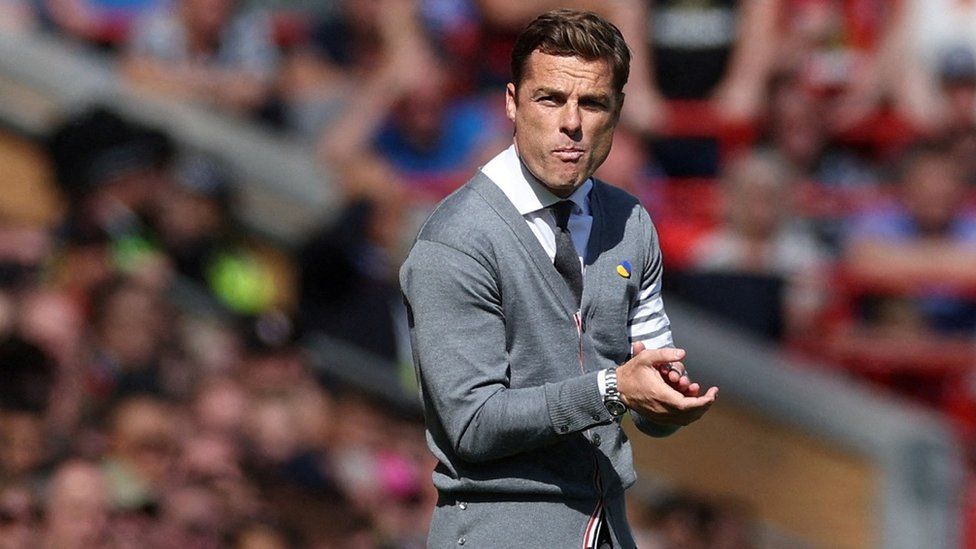 Former Bournemouth manager Scott Parker wears a Thom Browne cardigan on the sidelines