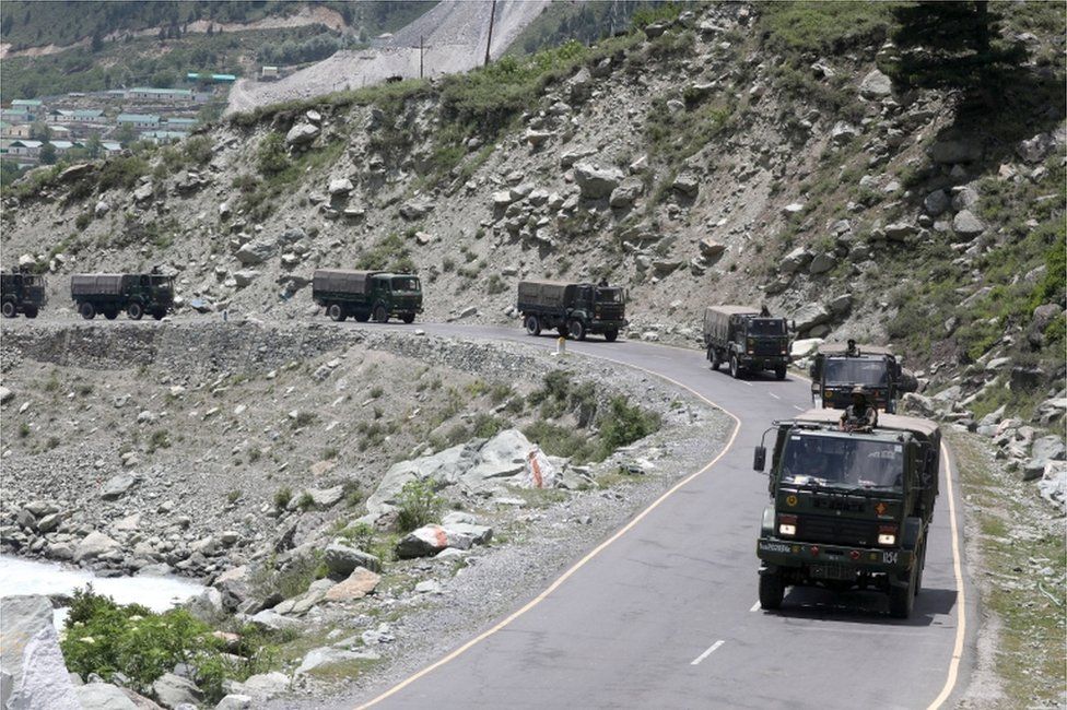 Indian army trucks move along a highway leading to Ladakh, at Gagangeer some 81 kilometres from Srinagar,