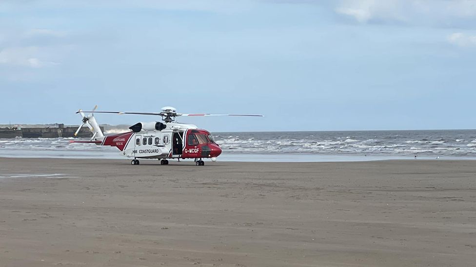 Coastguard helicopter on beach