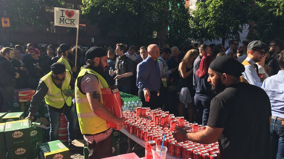 Manchester Sikh Community hand out free drinks
