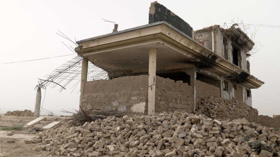 Badly damaged home in Sangin