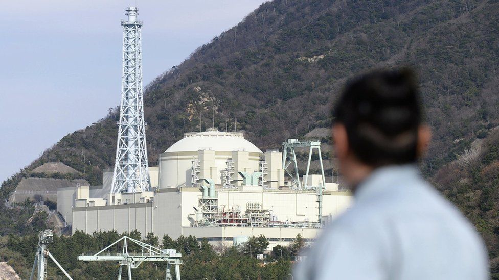 A resident looks at fast-breeder reactor Monju in Tsuruga, Fukui prefecture, on the Sea of Japan coast