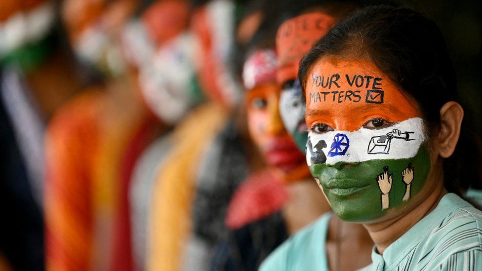 College students with painted faces spread awareness for first generation voters during an election campaign ahead of India's upcoming national election.