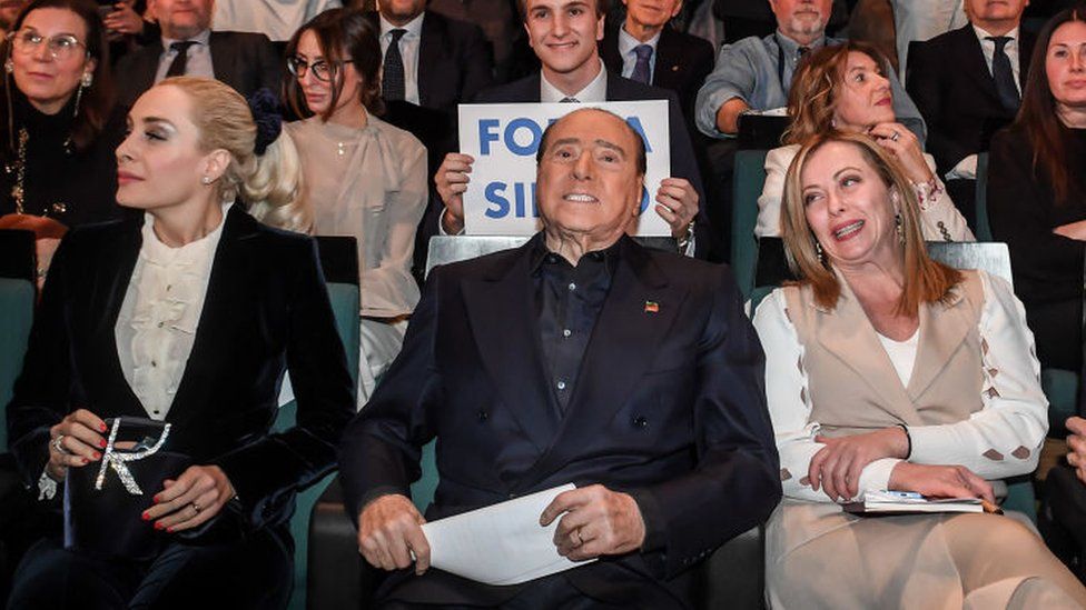 Marta Fascina (L) is an MP in Berlusconi's party, which plays an important role in the coalition of Giorgia Meloni (R)