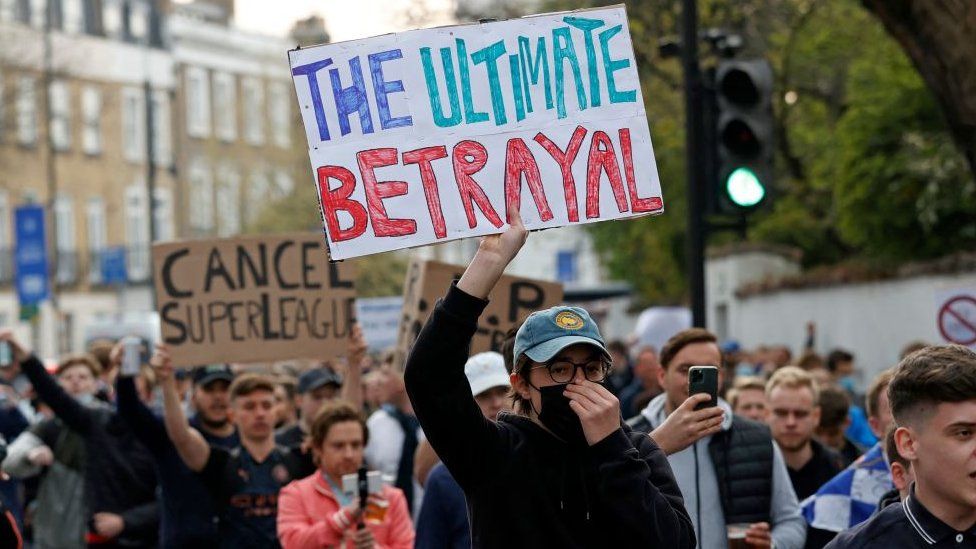 Fans protest outside Stamford Bridge stadium in London