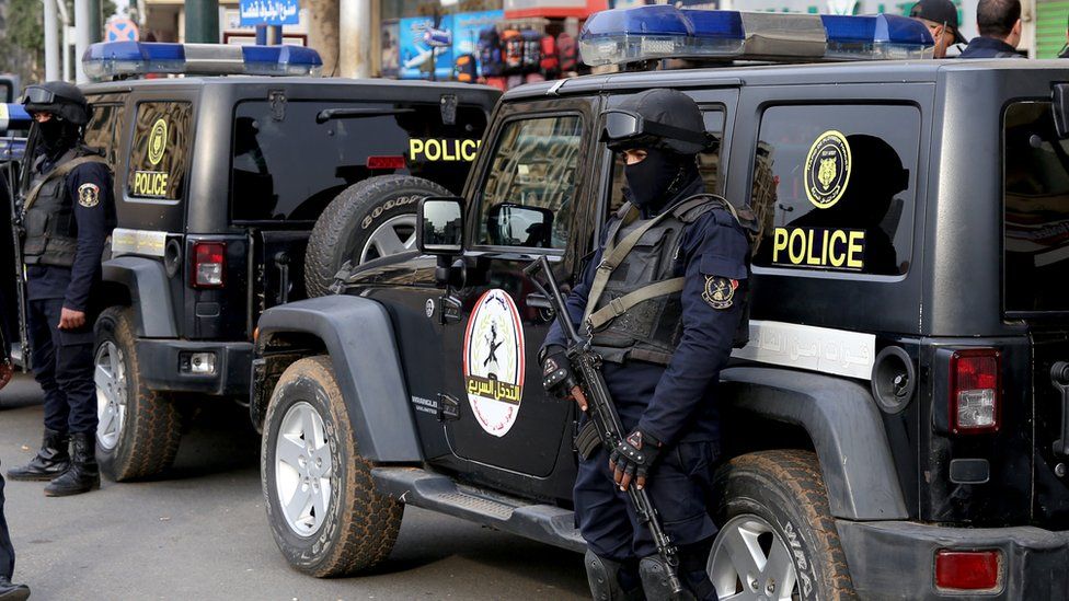 File photo showing Egyptian policemen standing guard in Cairo on 25 January 2017