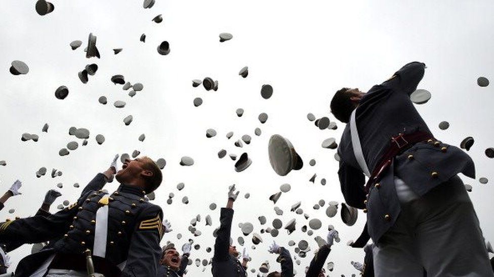 Cadets throw their hats in the air at the conclusion of the graduation ceremony at the US Military Academy at West Point (28 May 2014)