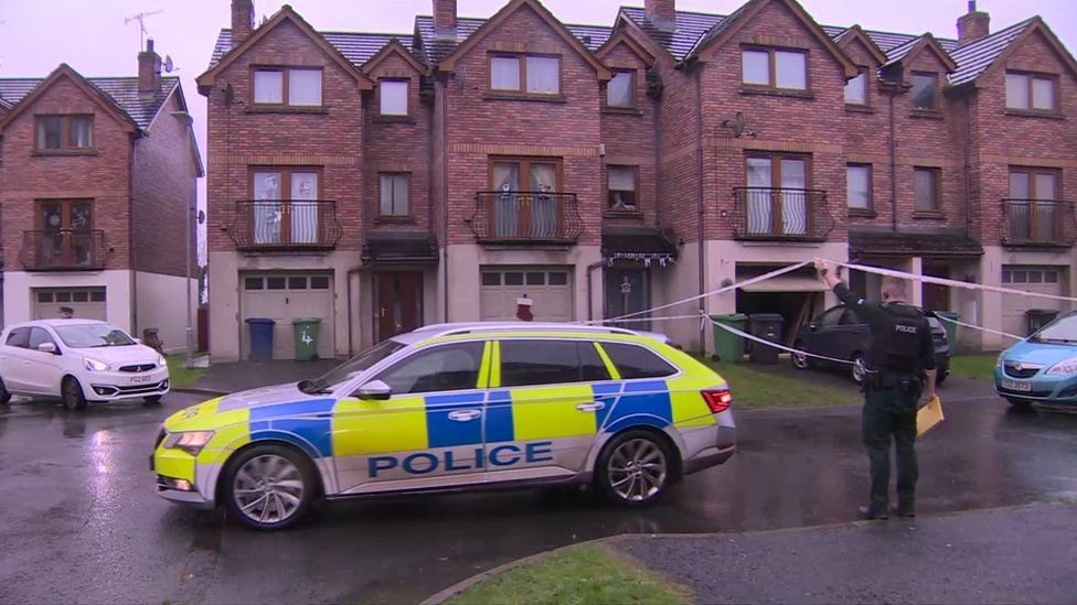 Police were still at the crime scene in Silverwood Green earlier on Friday