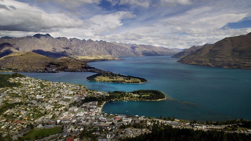 Queenstown is seen on the shores of Lake Wakatipu with the Remarkables mountain range in the background.