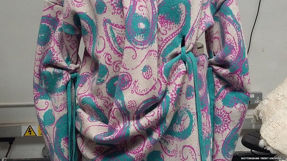 A dress with paisley pattern and drapes