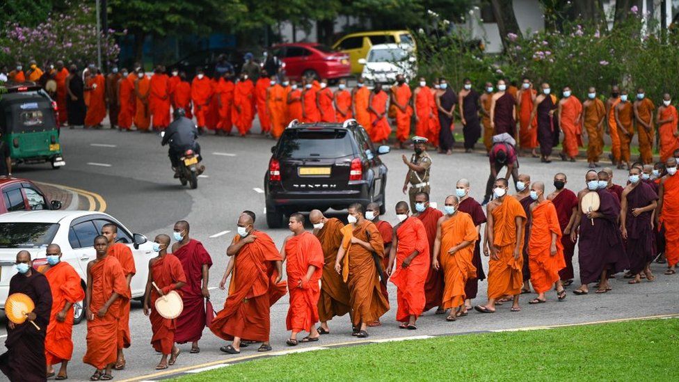 Buddhist monks arrive for a meeting at Colombo's Independence Memorial hall in Colombo on April 30, 2022, to express their solidarity with countrymen demonstrating against the government over the country's crippling economic crisis.