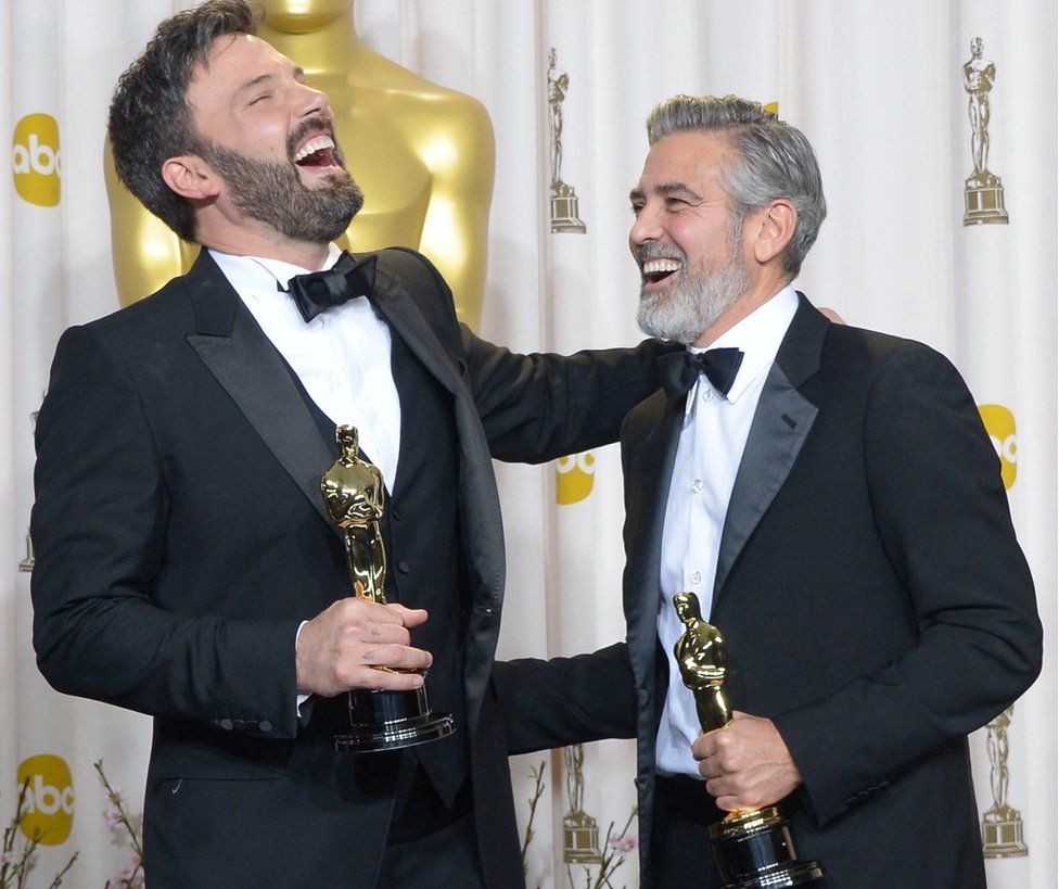 Ben Affleck (L) and George Clooney celebrating after winning Best Picture Oscar for Argo in 2013, which was the last time Warner Bros. won the top award