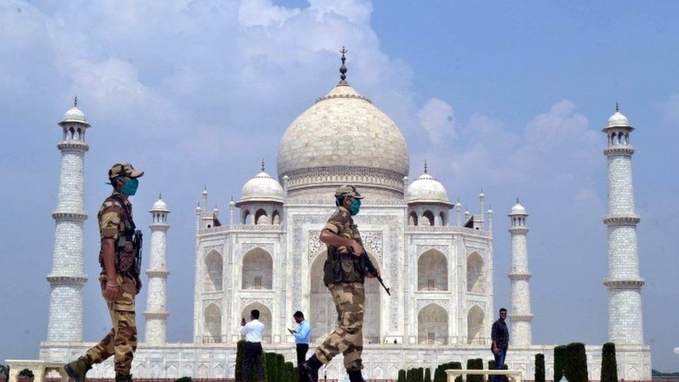 Indian security personnel stand guard at the Taj Mahal in Agra, Uttar Pradesh, India, 21 September 2020