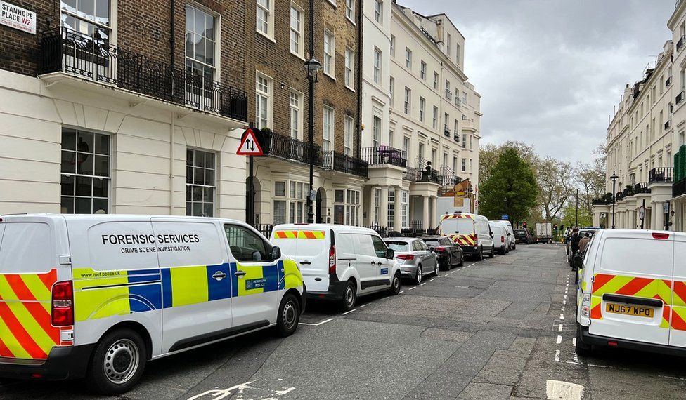 Police vehicles parked on street in Stanhope Place
