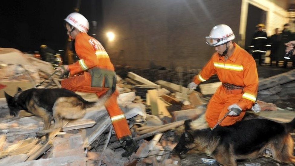 Rescuers search for survivors in Beiwudu town, Wuyang County, central China's Henan Province