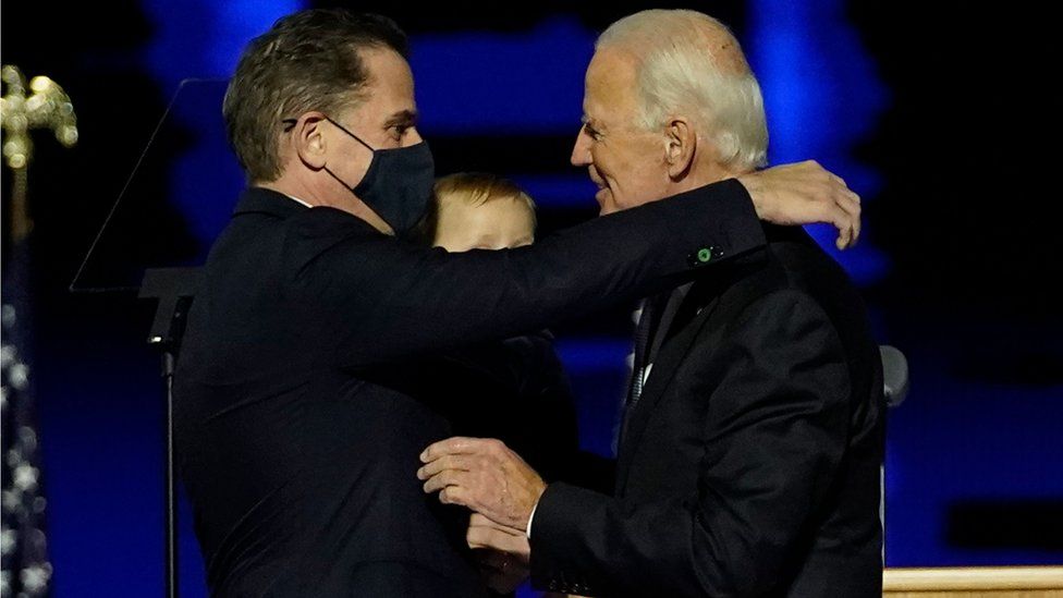 Joe Biden embraces his son Hunter Biden after addressing the nation from the Chase Center 7 November 2020 in Wilmington, Delaware.