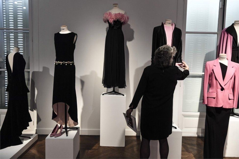 Several black dresses displayed together