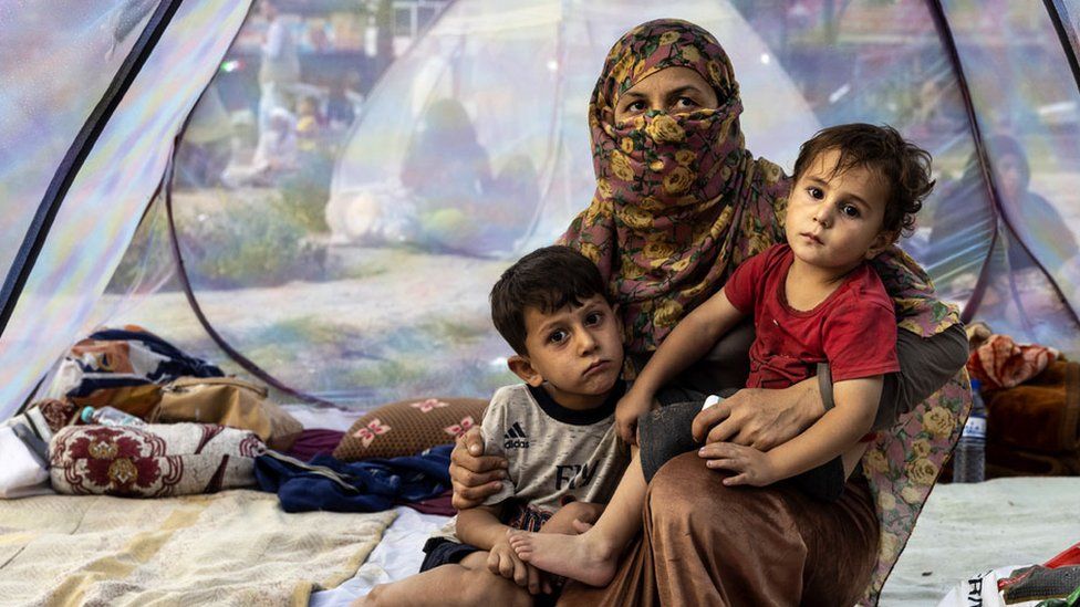 A displaced family in a tent at a makeshift camp in Kabul