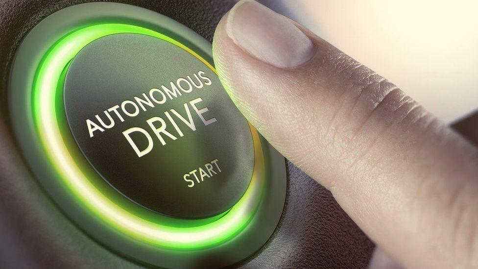 Graphic of autonomous drive button in car