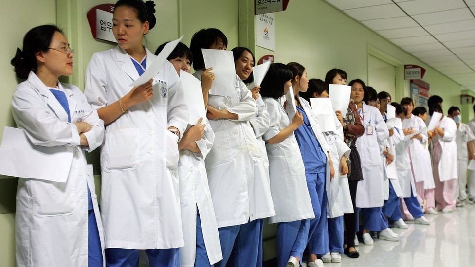Medical workers of the Korea University Hospital wait for vaccination of H1N1 swine flu vaccine at Korea University Hospital on October 27, 2009 in Seoul, South Korea
