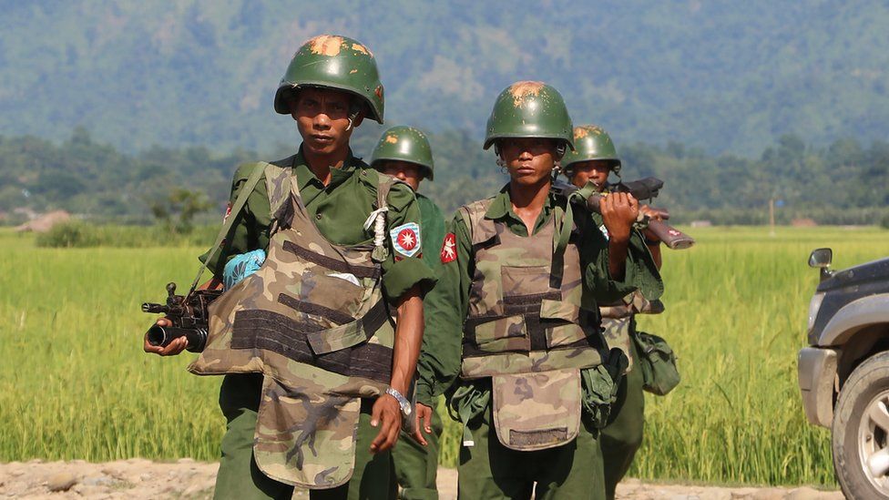 Myanmar soldiers patrol a village in Maungdaw located in Rakhine State, 21 October