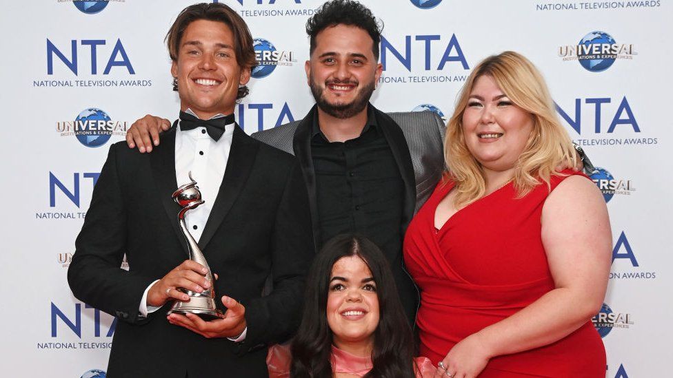 Aaron Evans, Wilfred Webster, Meryl Williams and Hannah Byczkowski, accepting the Reality Competition award on behalf of "The Traitors" at the National Television Awards 2023
