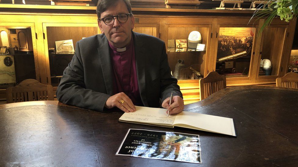 Bishop Andrew Forster signed a book of condolence at St Columb's Cathedral