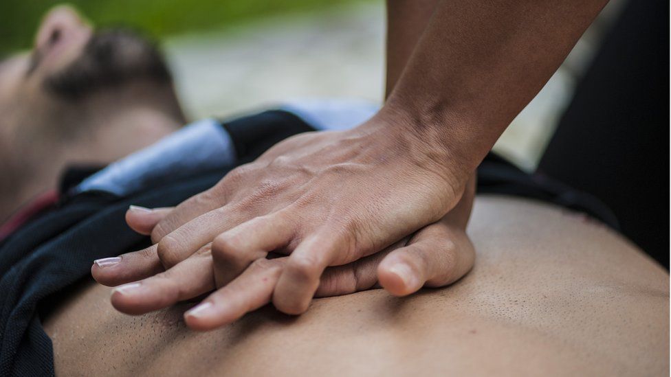 Giving chest compression to someone who has had a cardiac arrest