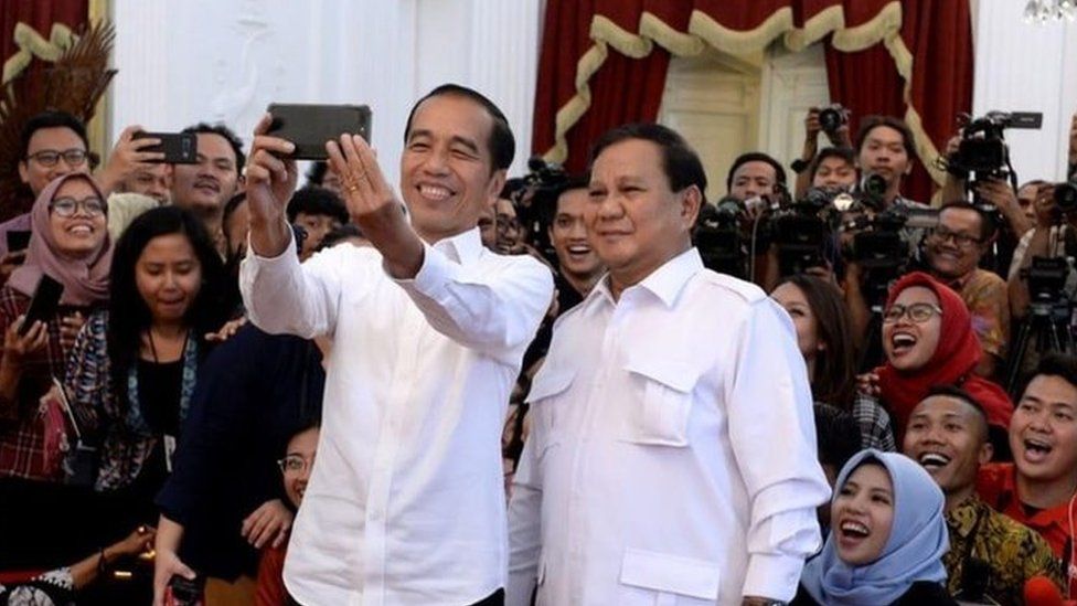 Joko Widodo and Prabowo Subianto pose for a selfie