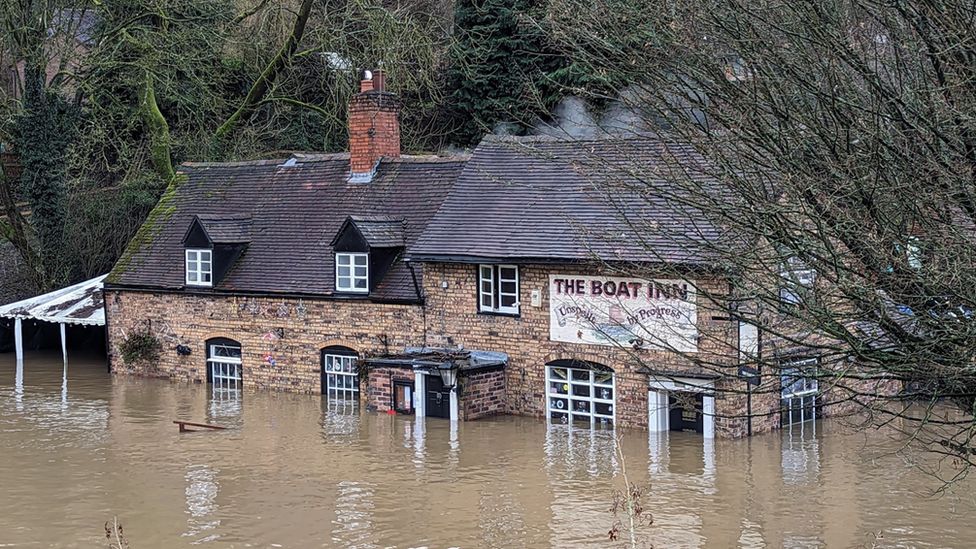 Handout photo courtesy of Liam Ball of the Boat Inn pub in Shropshire, surrounded by floodwater