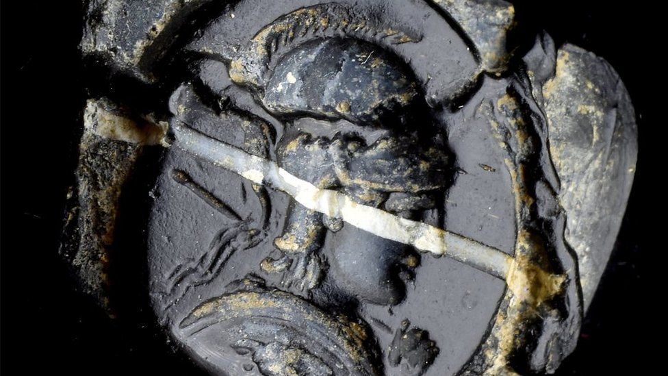 Intaglio with profile bust of Minerva or Athena in black glass with white band, Roman 1st Century BC - 1st Century AD