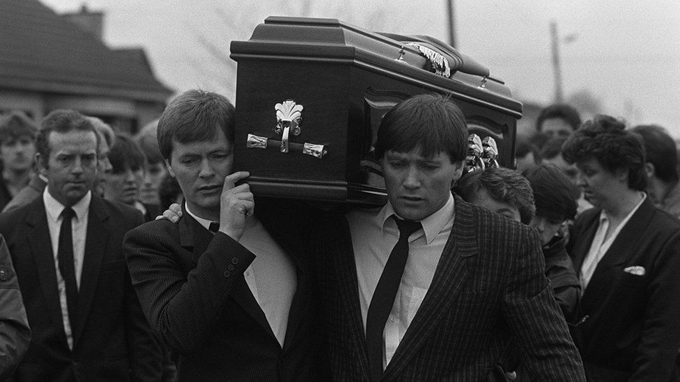 Francis McNally carries the coffin of his member  Phelim successful  1988