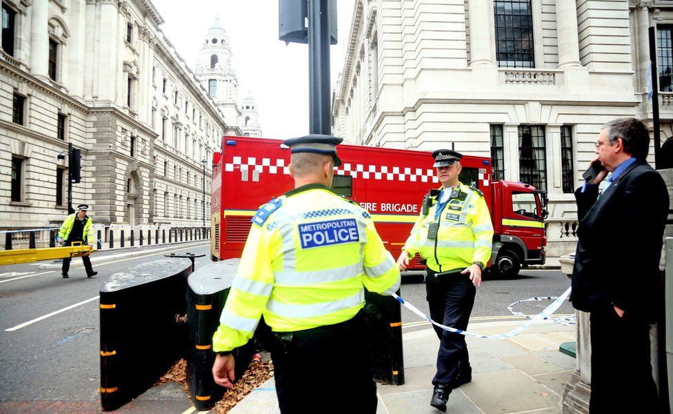 Police on Westminster Bridge, central London, after a car crashed into security barriers outside the Houses of Parliament