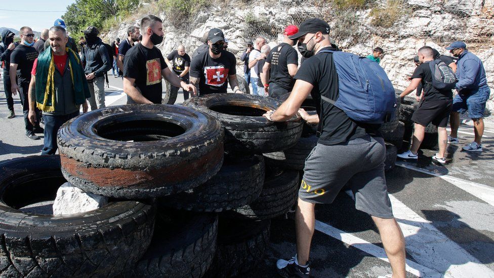 Demonstrators set up a barricade during a protest against the enthronement of Bishop Joanikije in Cetinje