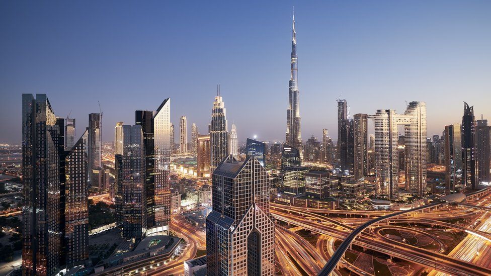 Dubai cityscape at night, an urban skyline with the Burj Khalifa