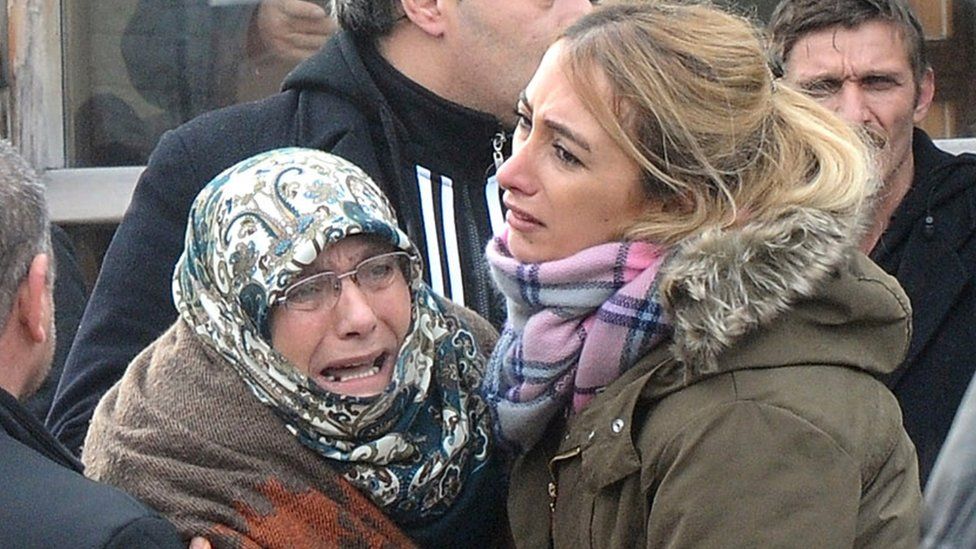 Family members of a victim cry outside the Forensic Medical Centre in Istanbul on 1 January 2017