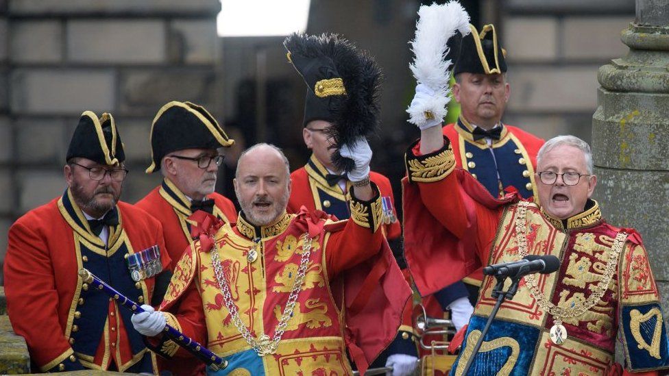 The Lord Lyon King of Arms, Joseph Morrow (R) attends the proclamation of King Charles III, outside St Giles' Cathedral in Edinburgh on 11 September 2022.