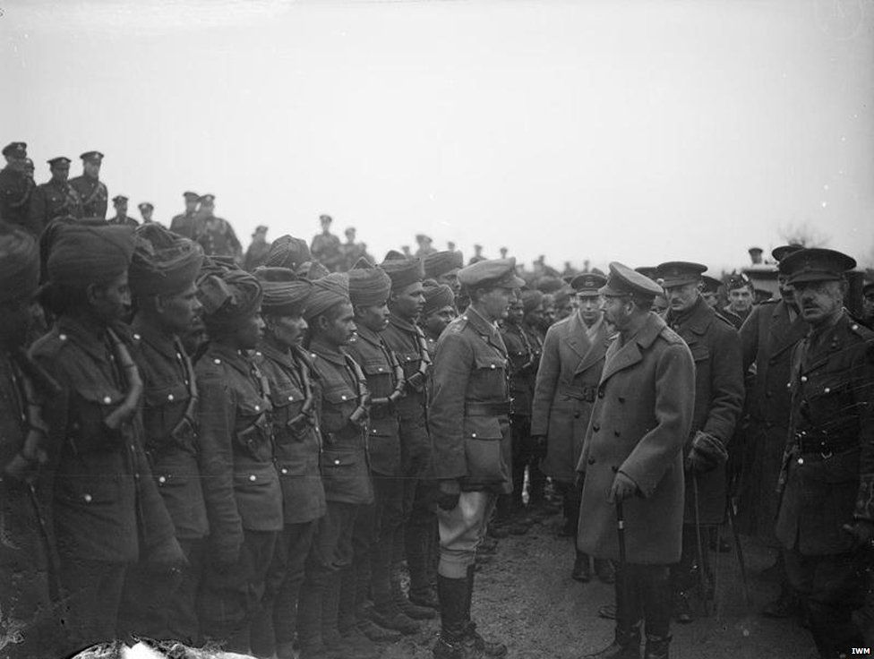 King George V inspecting Indian troops attached to the Royal Garrison Artillery, at Le Cateau on 2 December 1918.
