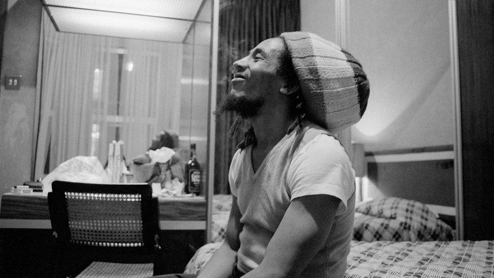 Bob Marley sitting on the bed of a rented apartment on Gloucester Road in London in February 1978