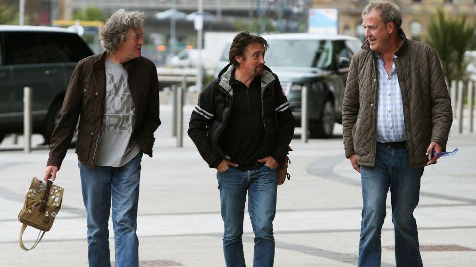 James May, Richard Hammond and Jeremy Clarkson walking outside