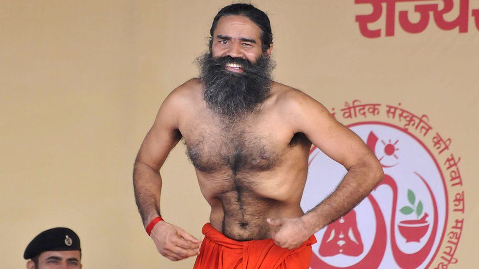 Yoga guru Ramdev, the brand ambassador of Yoga and Ayurveda in Haryana, organized Three-day yoga training camp, at Parade Ground in Sector 5, on June 12, 2016 in Panchkula, India. The state government has got yoga training imparted to the staff of police and Ayush department, yoga instructors and PTIs of the education department, school and college students, panches, sarpanches and other elected representatives of NGOs and other social organizations with the help of Patanjali Yog Peeth. A minimum of 2,100 participants take part in the district-level programme and about 500 in block-level programmes. (Photo by Sant Arora/Hindustan Times via Getty Images)