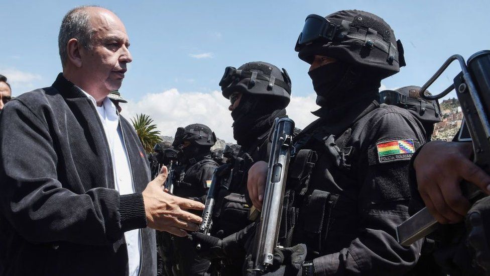 Bolivian Interim Minister of Government Arturo Murillo (L) greets members of the GAT anti-terrorist unit during its presentation in La Paz, on December 3, 2019