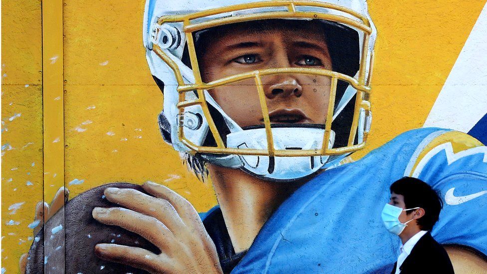 A mural of Chargers quarterback Justin Herbert decorates the exterior of a neighbourhood market ahead of the Super Bowl in Inglewood, California
