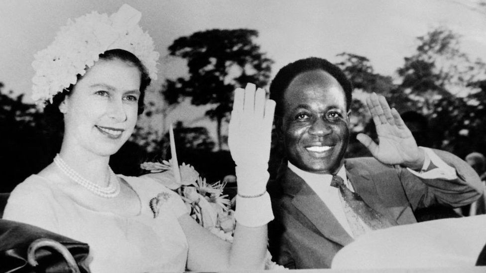 Queen Elizabeth II and President of Ghana Kwame Nkrumah wave to the crowd as part of a state visit in Ghana on November 1961