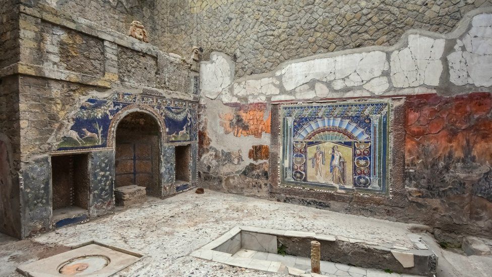 Inside of a villa with mosaics on wall
