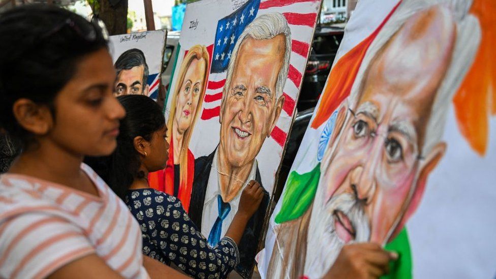 Students give final touches to paintings of US President Joe Biden, Indian Prime Minister Narendra Modi and Italian Prime Minister Giorgia Meloni at an art school in Mumbai on September 5, 2023, ahead of the two-day G20 summit in New Delhi.