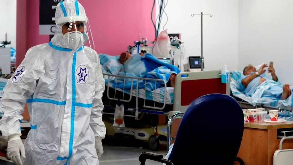 Medics wearing protective gear visit patients at the coronavirus ward of the Rambam Health Care Campus, in the northern Israeli city of Haifa (11 October 2020)
