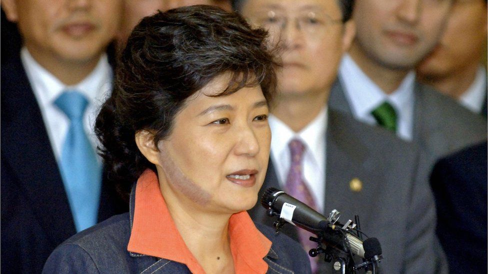 Park Geun-Hye speaks to supporters in Seoul on 29 May 2006, as she is discharged from hospital nine days after she was slashed in the face by an attacker. The image shows an 11cm scar on the right side of her face.